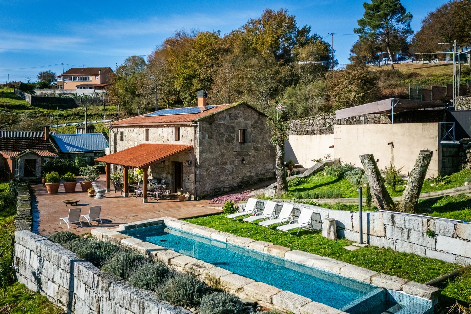 Parking area just beside with a ramp down to the house